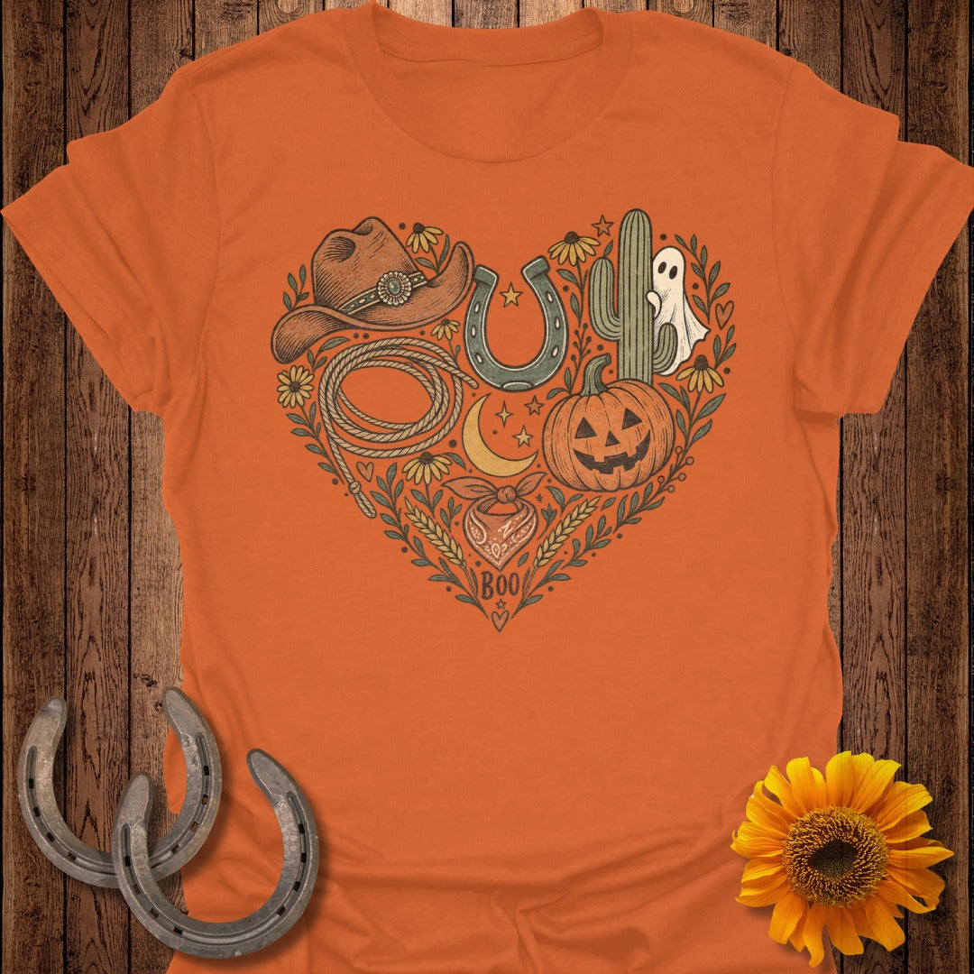 Orange t-shirt with heart graphic featuring cowboy hat, lasso, pumpkin, and ghost.