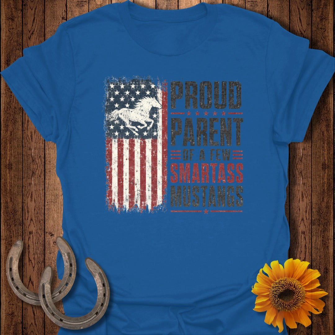 Blue t-shirt with distressed American flag graphic and "Proud Parent Of A Few Smartass Mustangs" text.