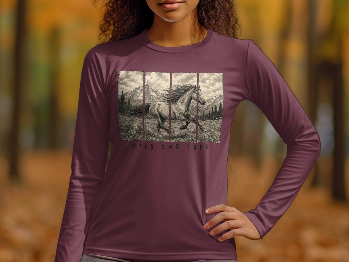 Long sleeve shirt with a running horse and mountains graphic, text "WILD AND FREE".