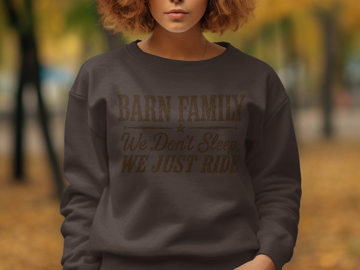 Dark gray sweatshirt with text: Barn Family, We Don't Sleep, We Just Ride.