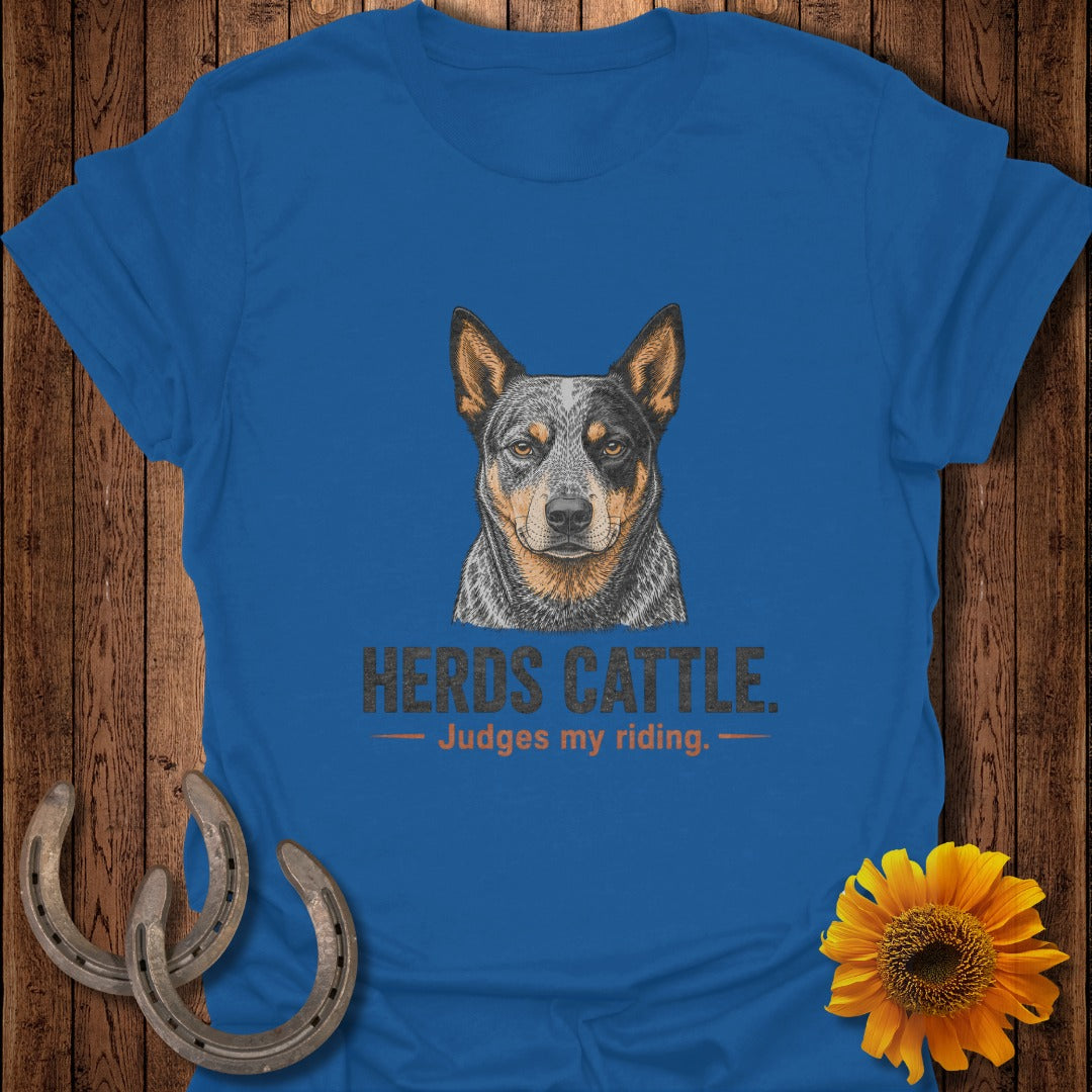 Blue t-shirt with illustration of Australian Cattle Dog and text "HERDS CATTLE. Judges my riding."