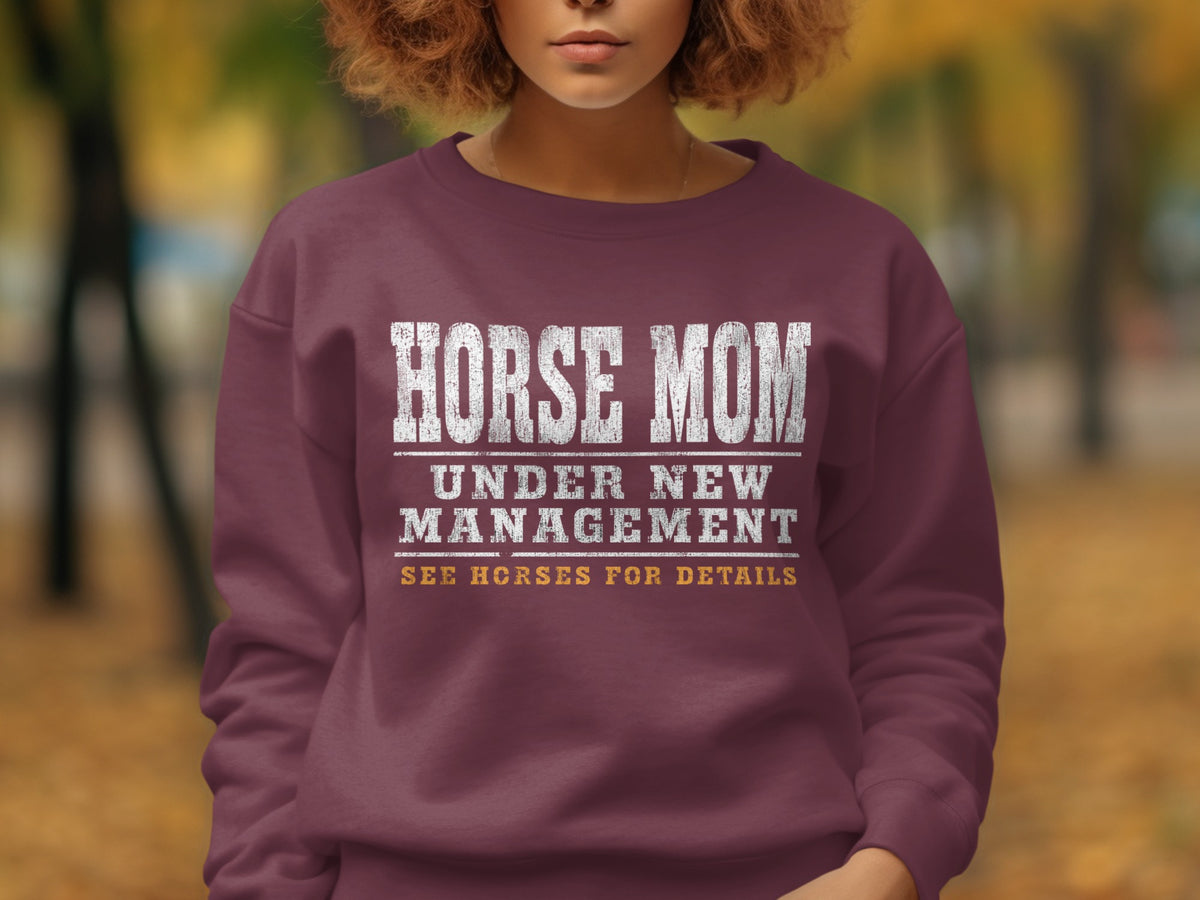 Maroon sweatshirt with "HORSE MOM UNDER NEW MANAGEMENT SEE HORSES FOR DETAILS" text.