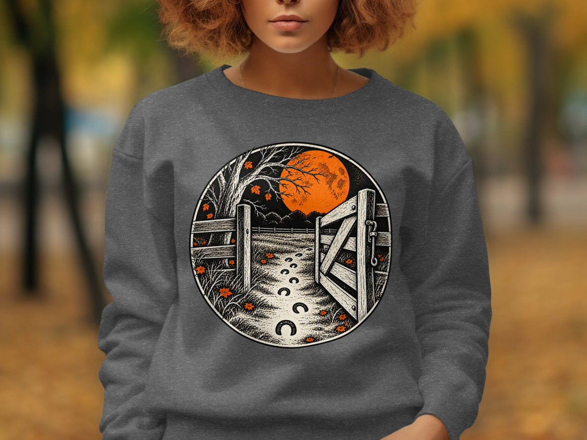 Circular graphic of an open gate with horseshoe prints leading to an orange moon.