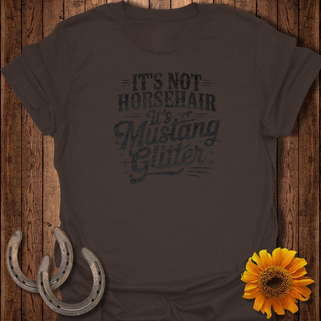 Dark brown t-shirt with "It's Not Horsehair, It's Mustang Glitter" text.