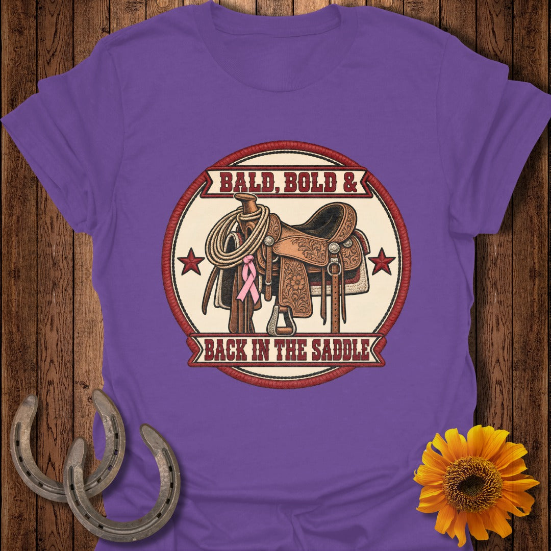 Western saddle with rope and pink ribbon, text "Bald, Bold & Back In The Saddle."