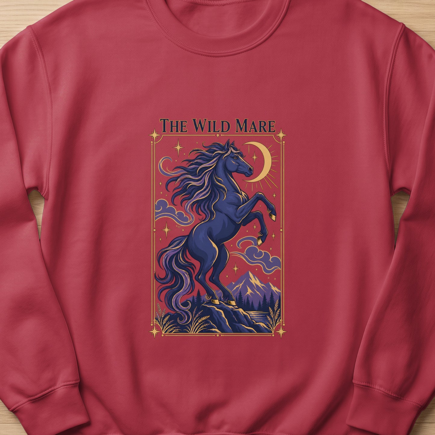 Dark blue horse rearing under a crescent moon with text "The Wild Mare".