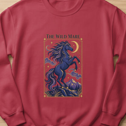 Dark blue horse rearing under a crescent moon with text "The Wild Mare".