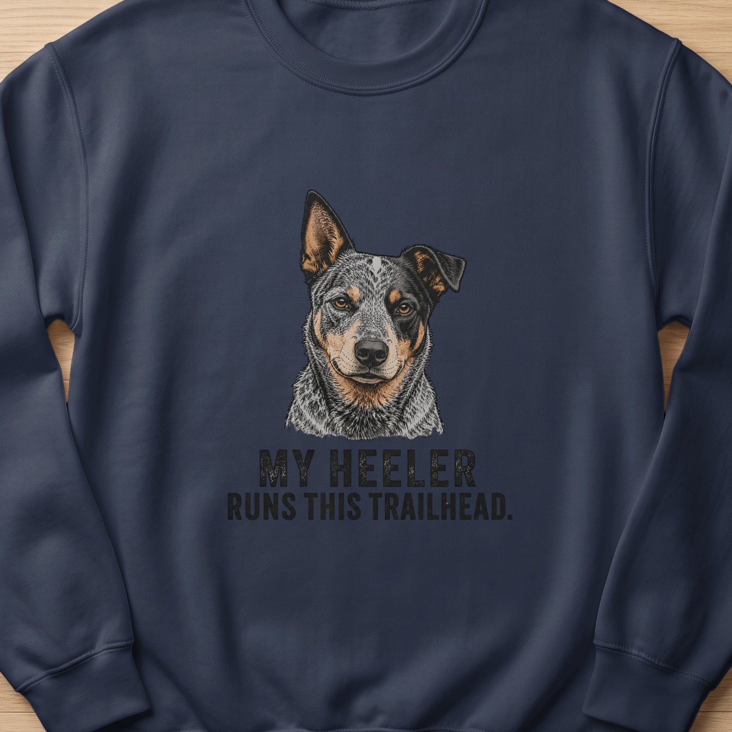 Navy sweatshirt with Australian Cattle Dog illustration and text "MY HEELER RUNS THIS TRAILHEAD."