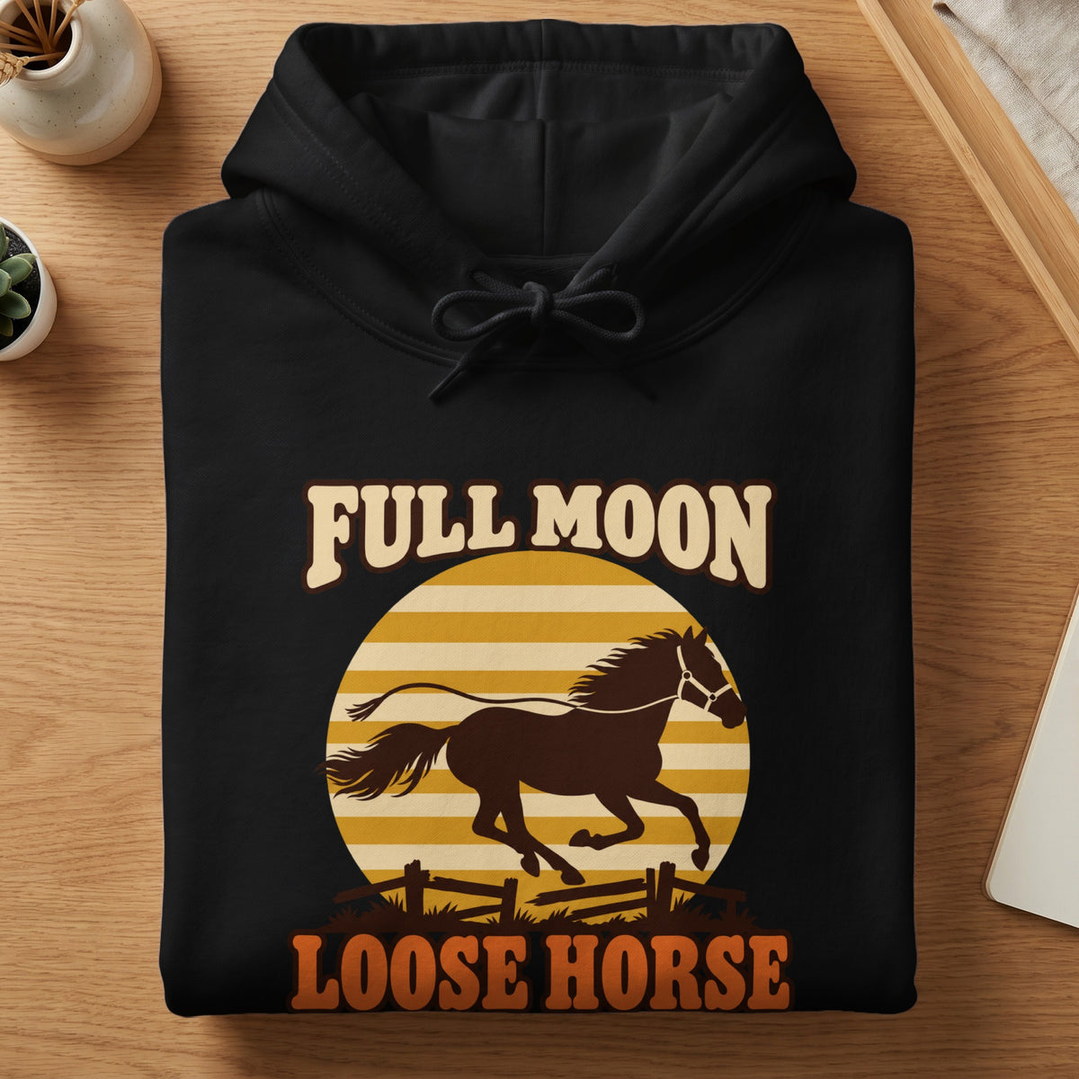 Black hoodie with "FULL MOON LOOSE HORSE" text and horse graphic.