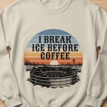 Cream sweatshirt with "I Break Ice Before Coffee" text and winter livestock watering tank graphic.
