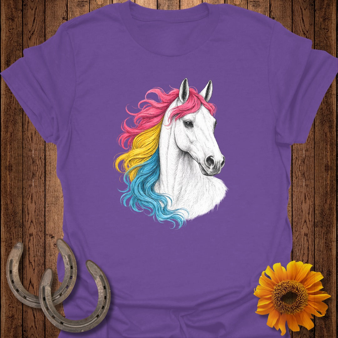 White horse with rainbow mane on purple t-shirt, framed by horseshoes and sunflower.