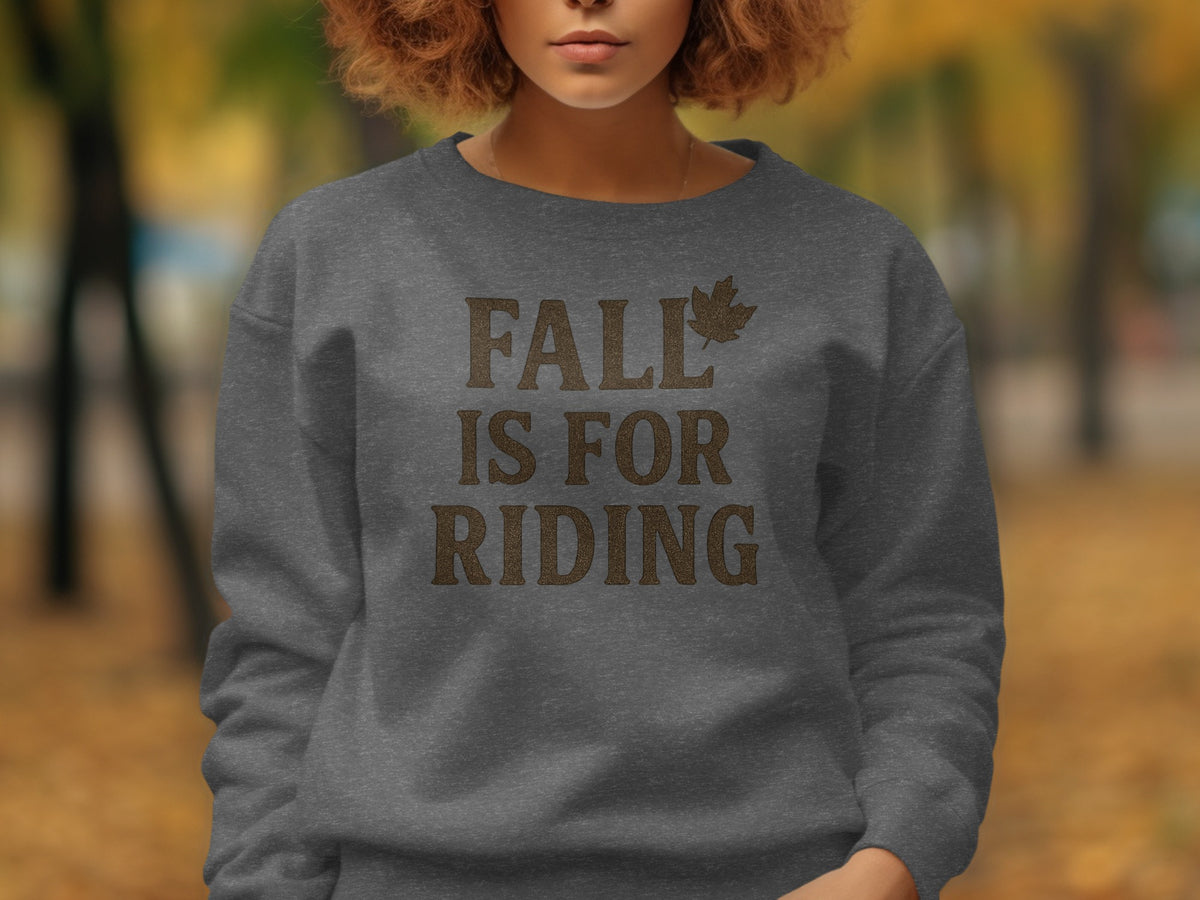 Dark grey sweatshirt with "FALL IS FOR RIDING" text and leaf graphic.