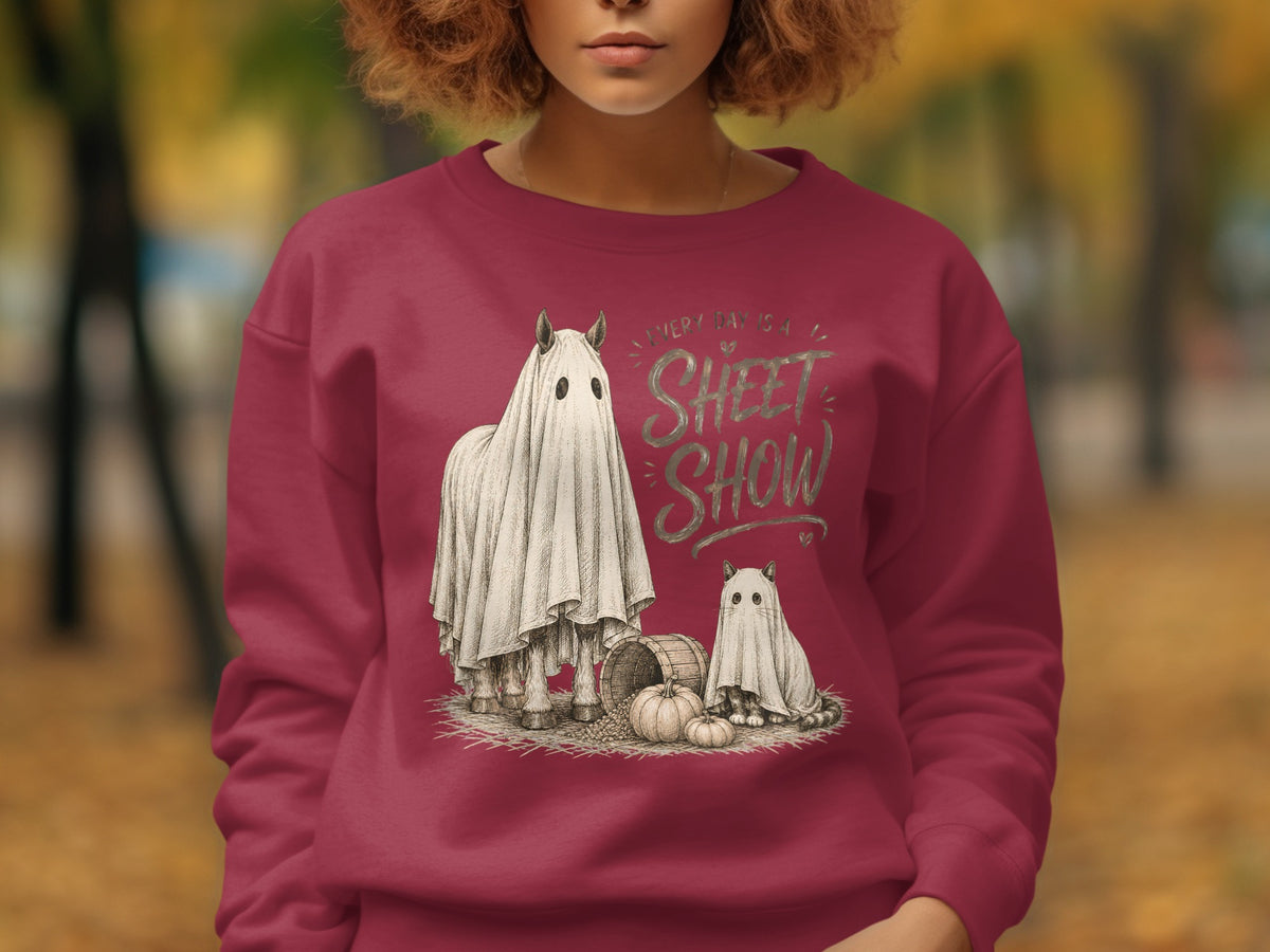 Crewneck sweatshirt with "Every Day is a Sheet Show" text and ghost horse and cat graphic.