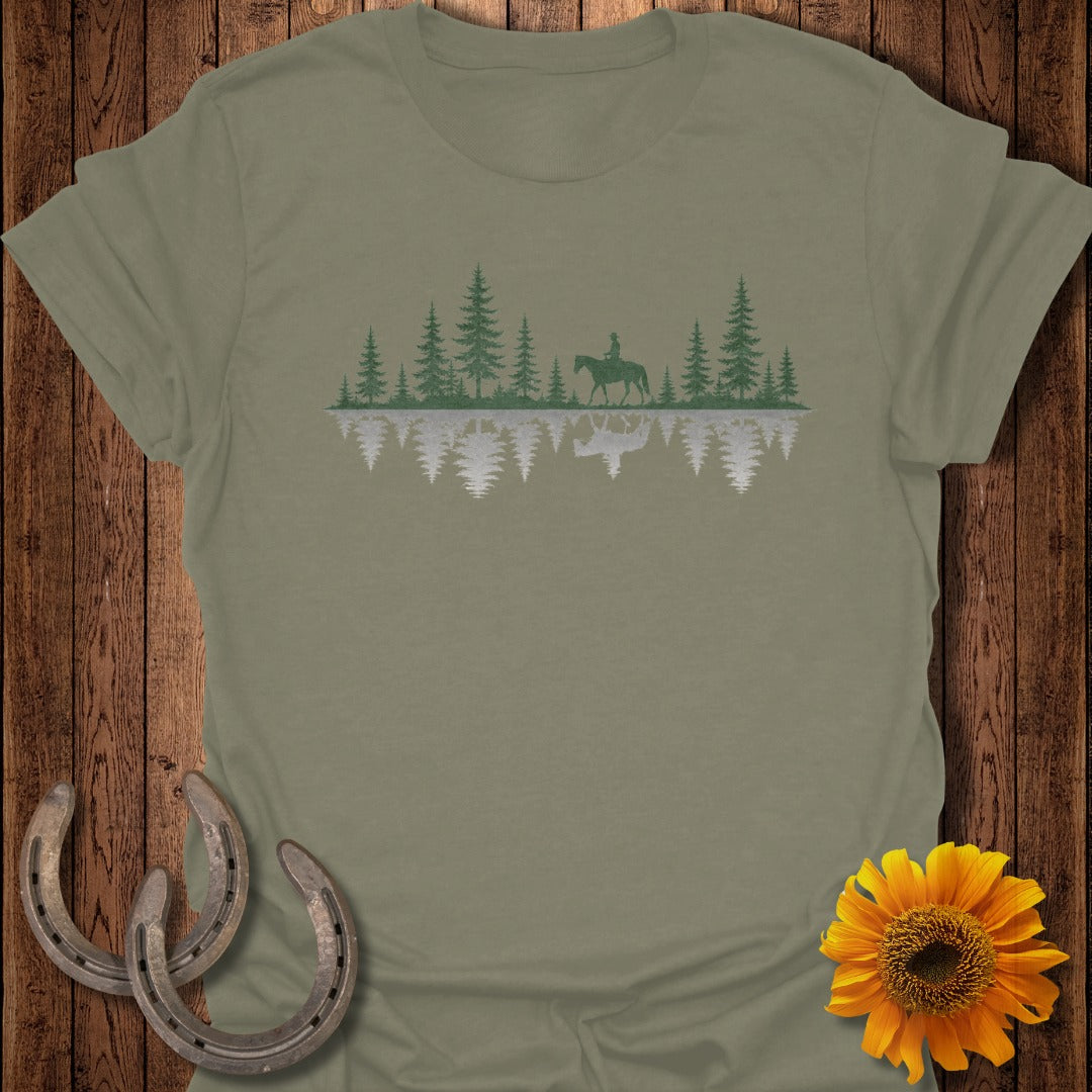 T-shirt with pine trees, a rider on horseback, and their reflection.