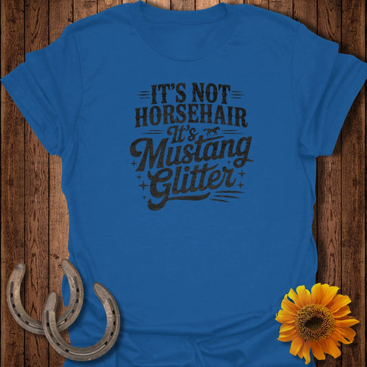 Blue t-shirt with "It's Not Horsehair, It's Mustang Glitter" text.