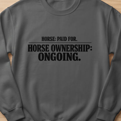 Dark grey sweatshirt with black text: Horse: Paid For. Horse Ownership: Ongoing.