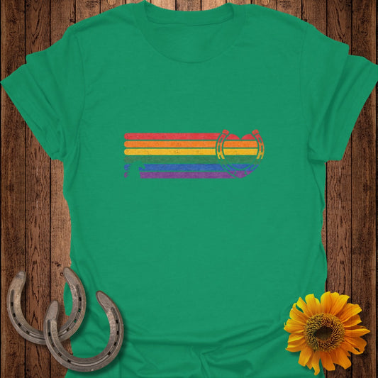 Green t-shirt with distressed rainbow horseshoe graphic.