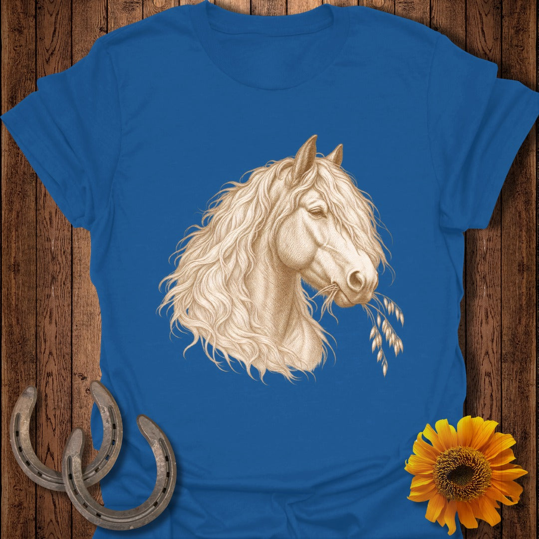 Blue t-shirt with drawing of a white horse eating oats, two horseshoes, and a sunflower.