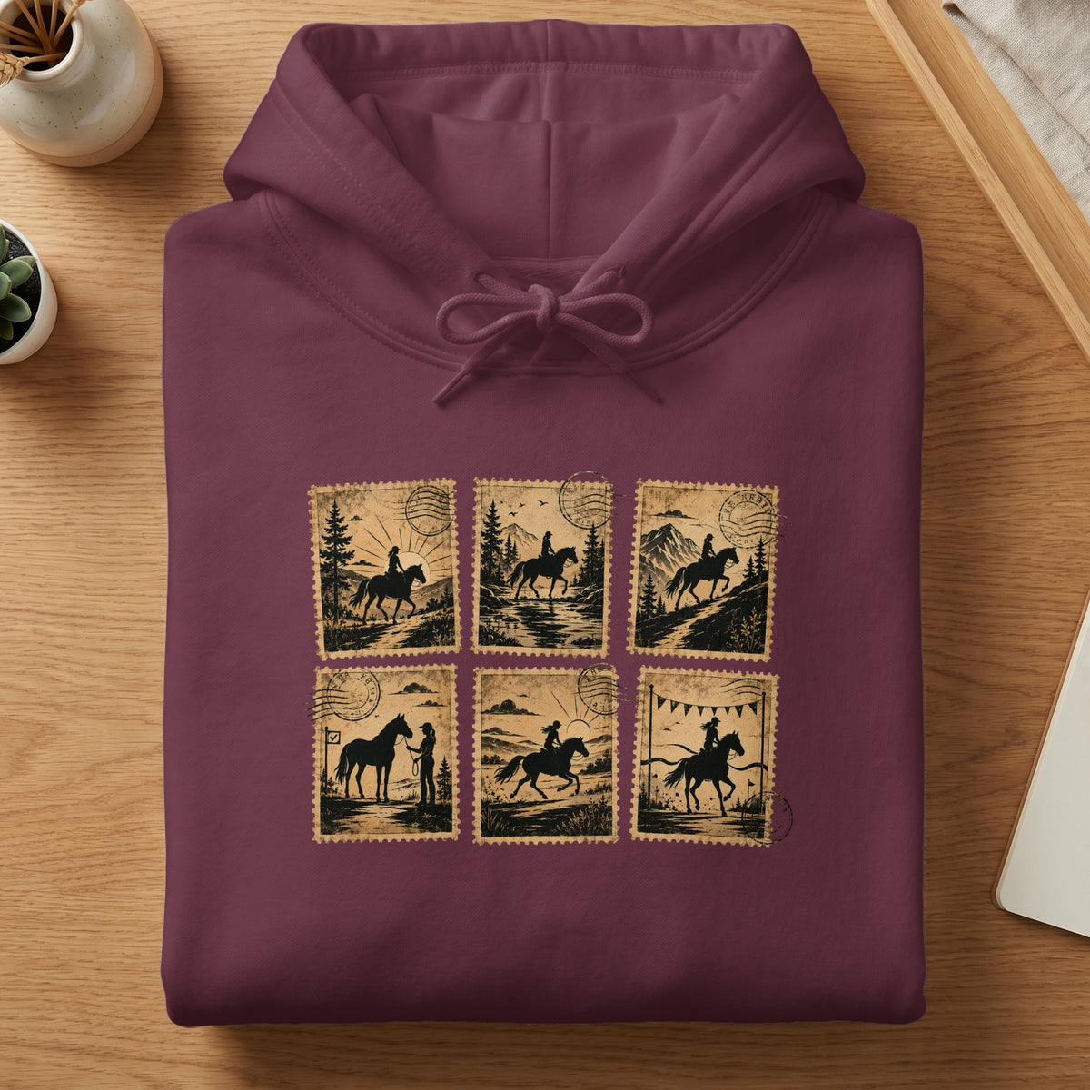 Maroon hoodie with a graphic of six vintage postage stamps depicting horseback riders.