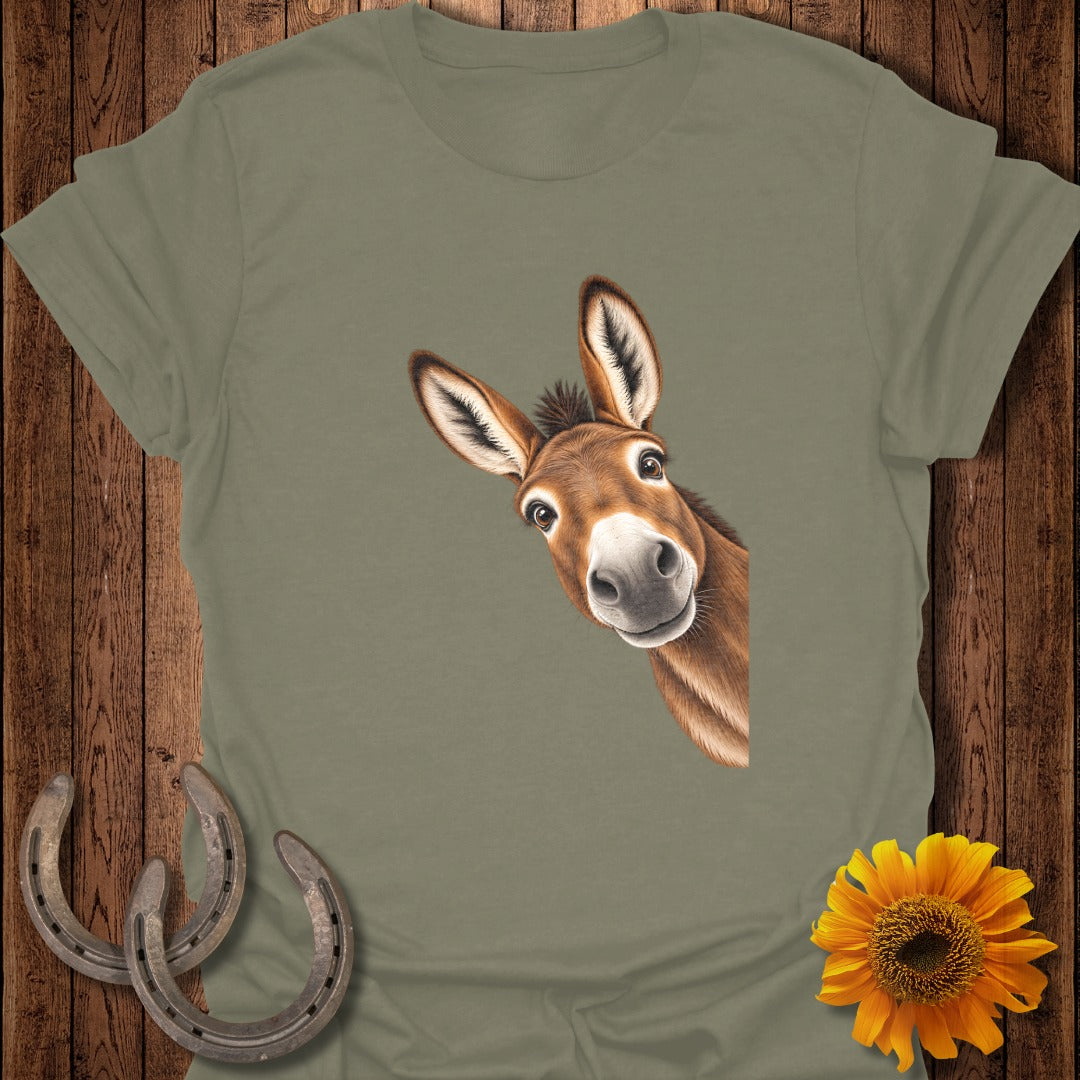 T-shirt with a peeking donkey illustration, two horseshoes, and a sunflower.