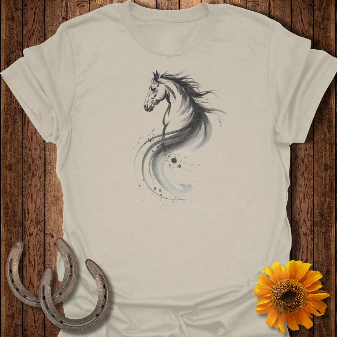 Watercolor horse silhouette with flowing mane against light-colored t-shirt.