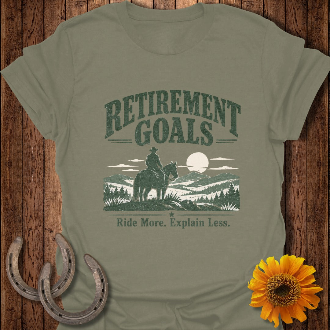 Olive green t-shirt with "Retirement Goals" and a cowboy on a horse.
