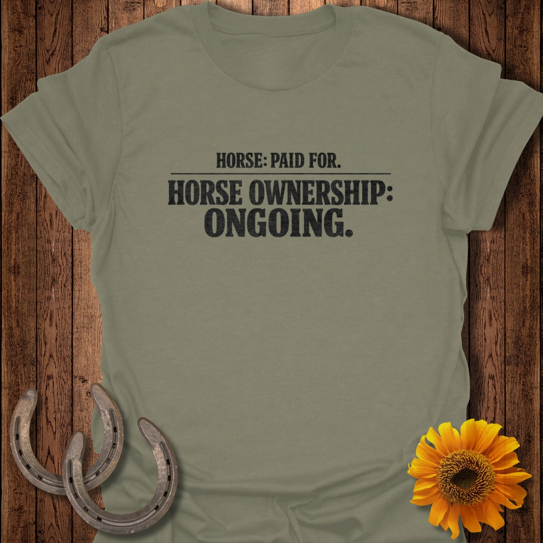 Olive green t-shirt with text "Horse: Paid For. Horse Ownership: Ongoing."
