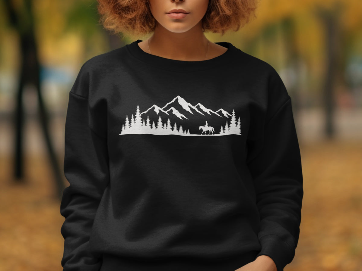 Black sweatshirt with white mountain, pine trees, and equestrian graphic.