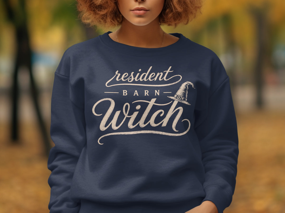 Dark navy sweatshirt with "resident BARN Witch" and witch hat graphic.