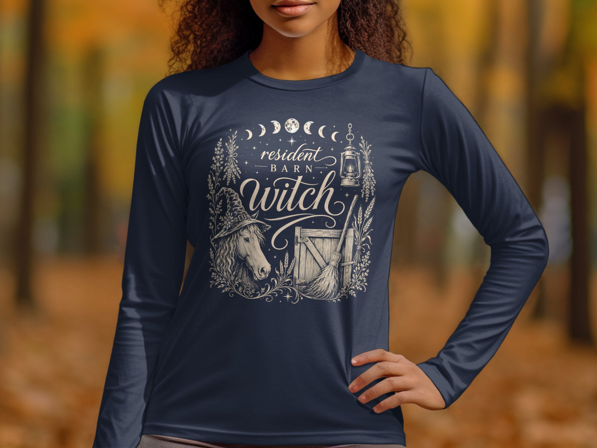 Long sleeve navy shirt with "Resident Barn Witch" design featuring horse, broom, and lantern.