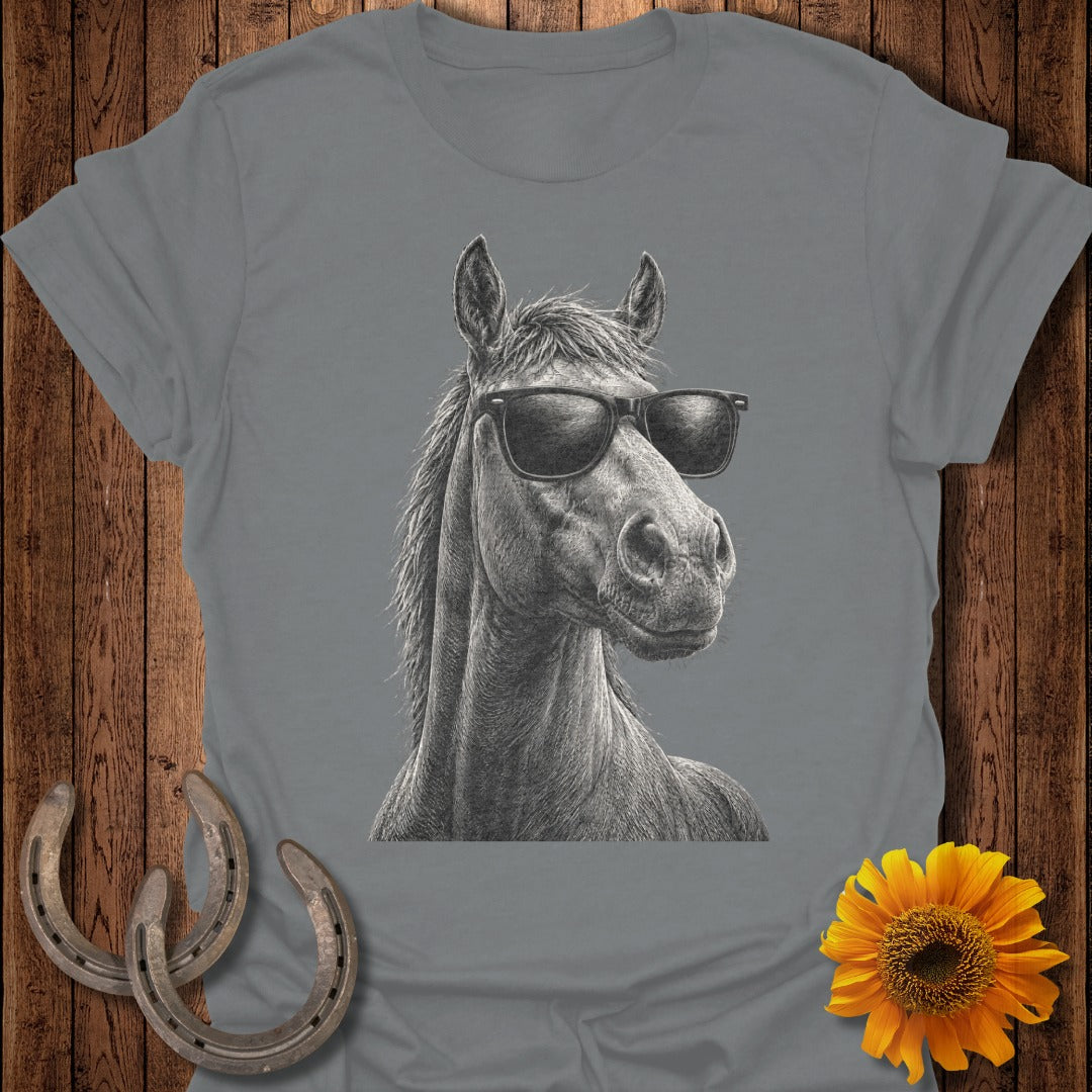 Horse wearing sunglasses on a t-shirt with sunflowers and horseshoes.