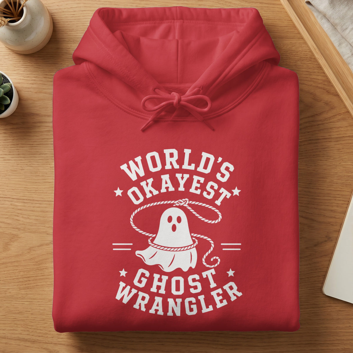 Red hoodie with white text and ghost graphic: "World's Okayest Ghost Wrangler".