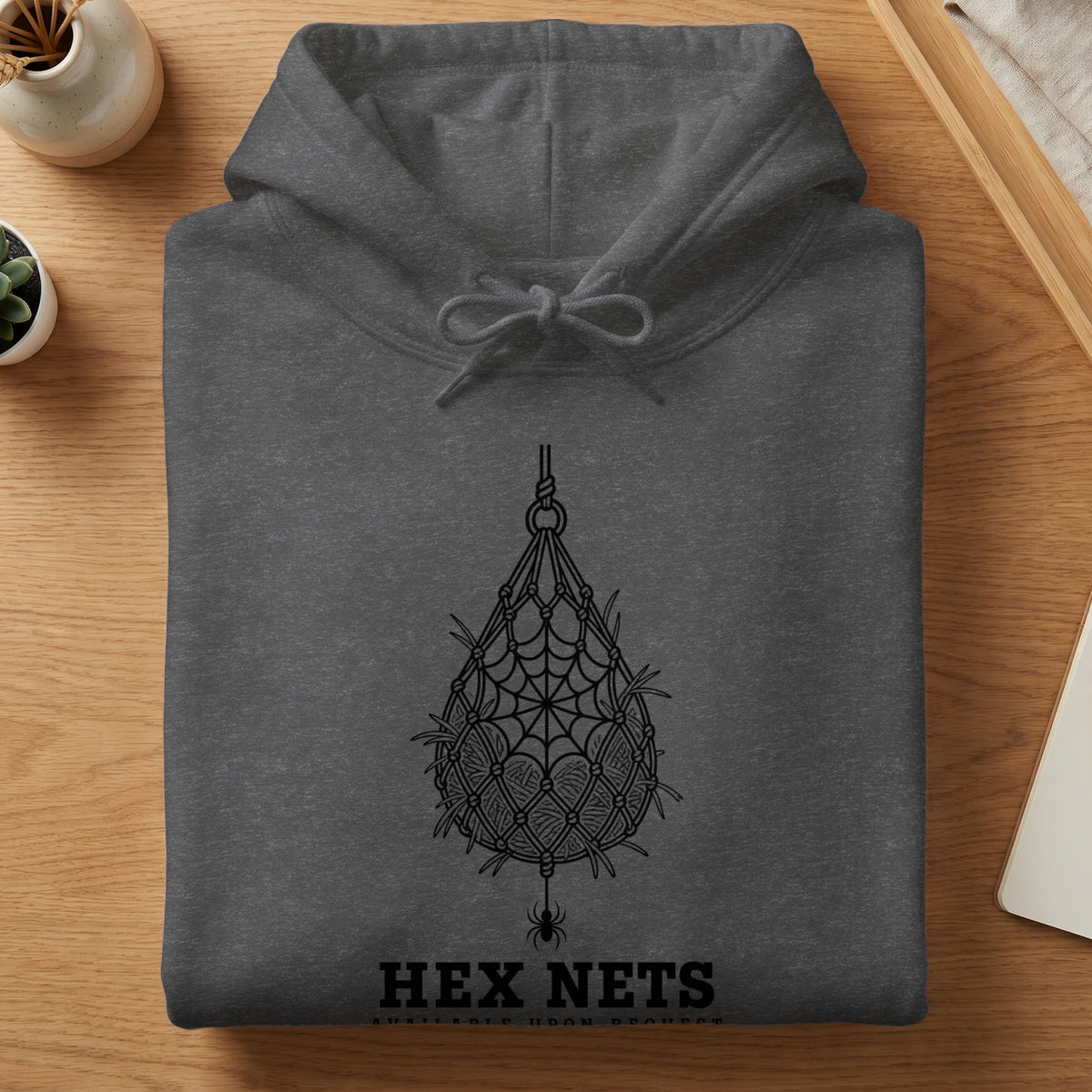 Dark grey hoodie with macrame spiderweb design and "HEX NETS" text.
