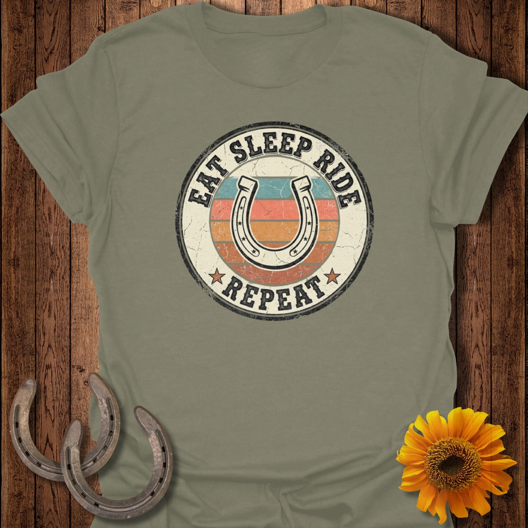 Circular graphic with horseshoes, sun, and text "EAT SLEEP RIDE REPEAT".