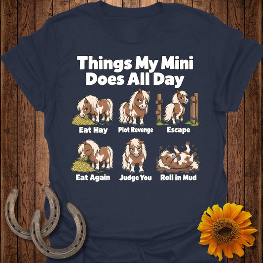 T-shirt with "Things My Mini Does All Day" text and cartoon ponies eating, escaping, and rolling in mud.