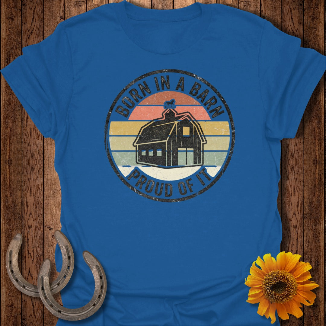 Blue t-shirt with distressed circular graphic: "Born in a Barn. Proud of It."