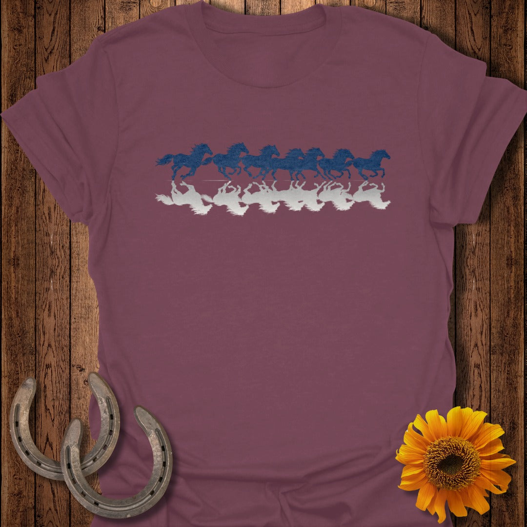 Maroon t-shirt with blue and white running horses reflection graphic.