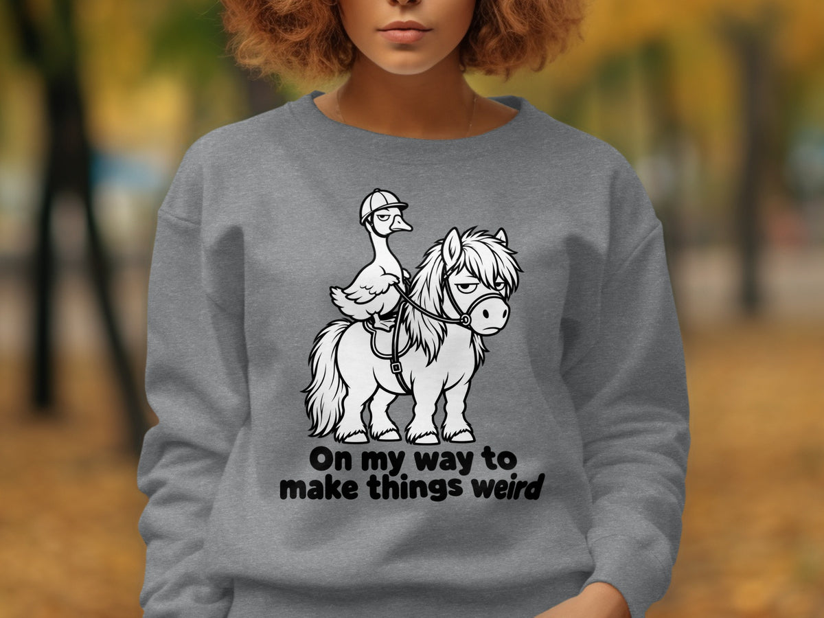 Gray sweatshirt with cartoon duck riding a horse and text "On my way to make things weird".