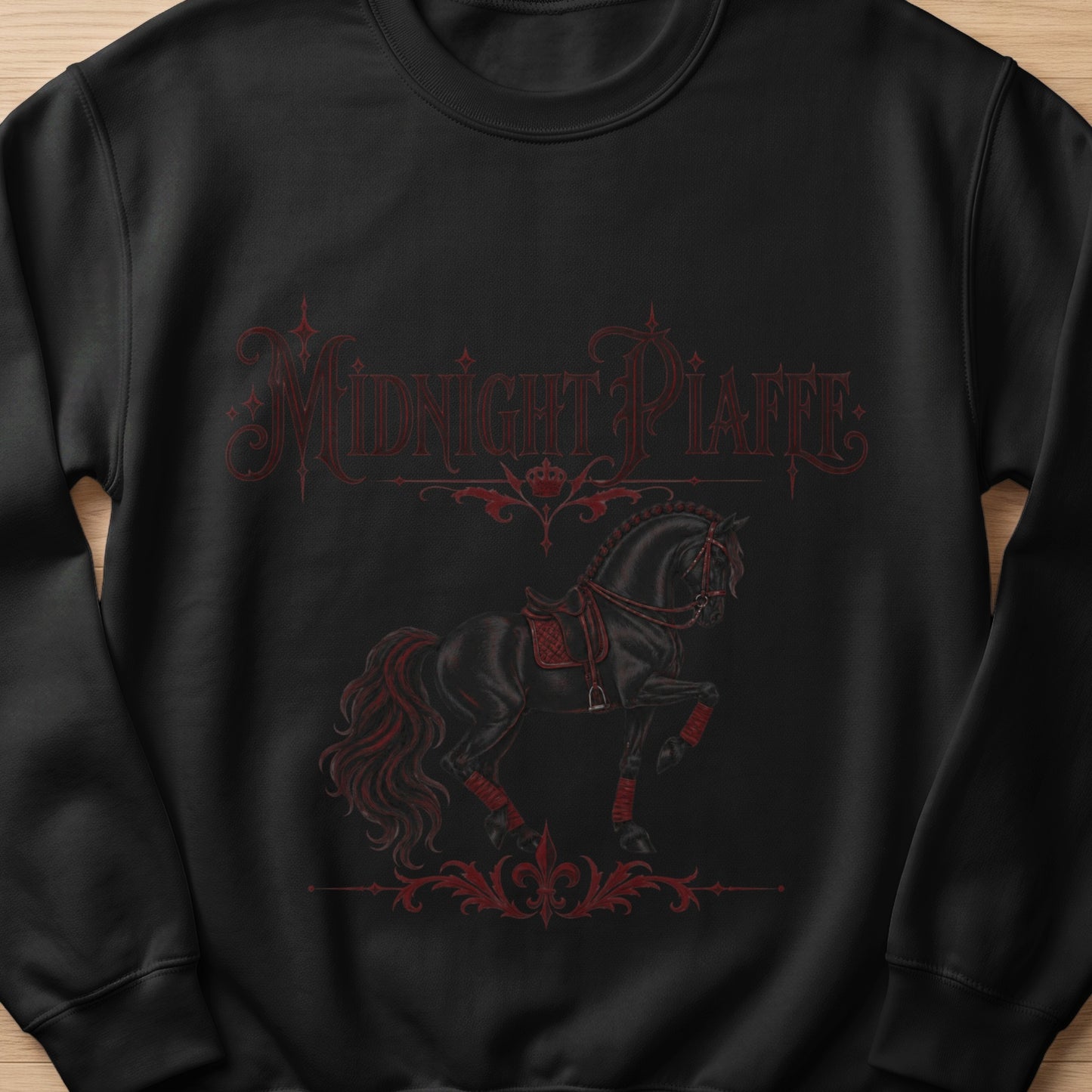 Black sweatshirt with red "Midnight Piaffe" text and a black horse.