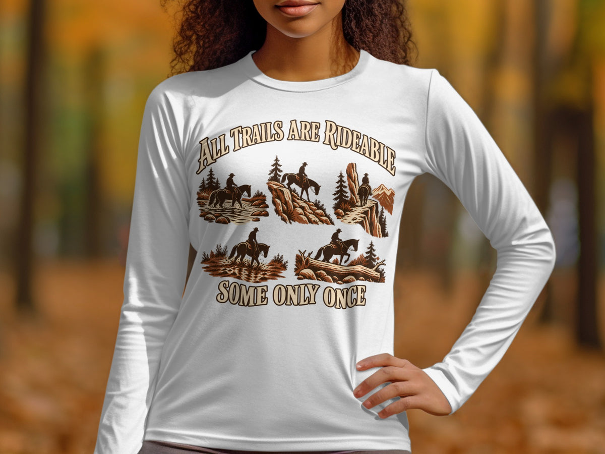 White long-sleeve shirt with "All Trails Are Rideable" and cowboy scenes.
