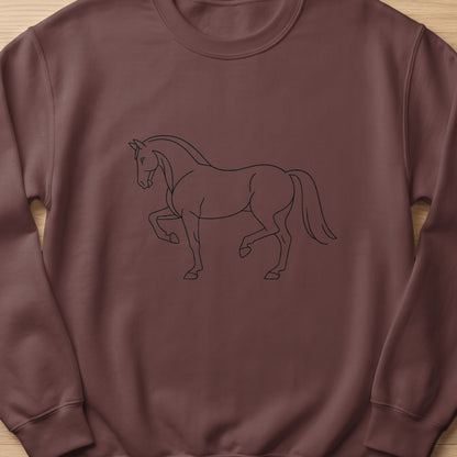 Line art drawing of a horse with one front leg raised on a brown sweatshirt.