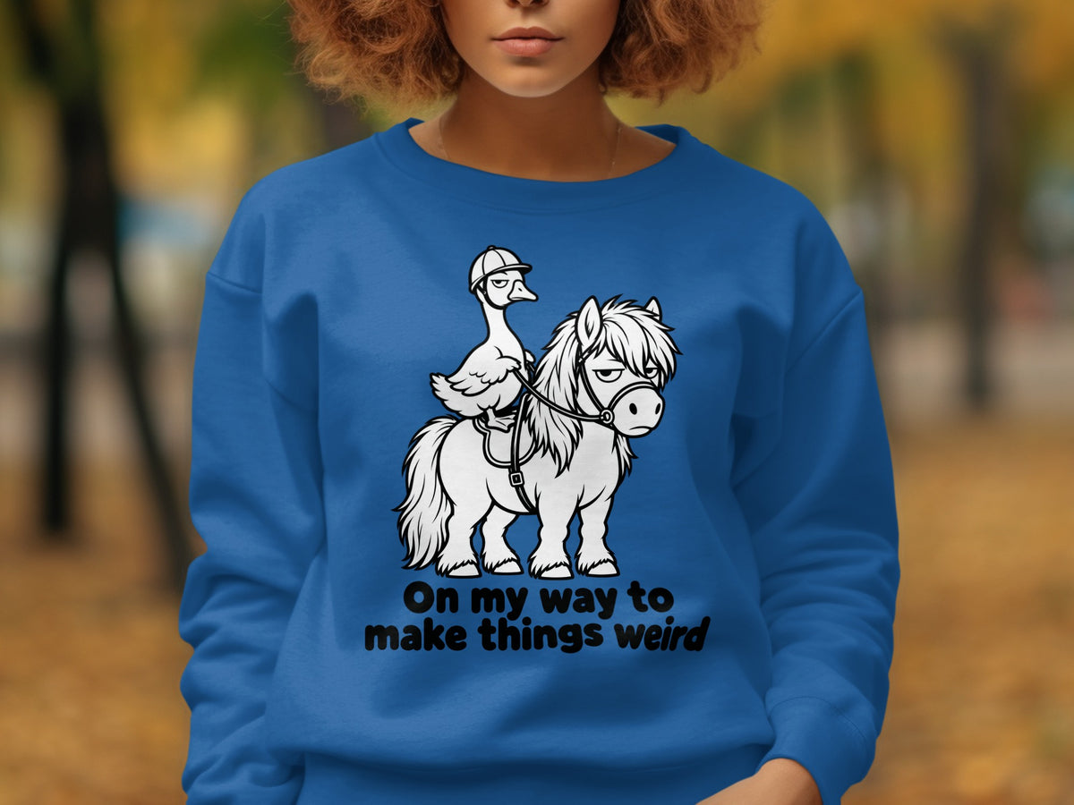Cartoon goose in a helmet rides a horse with text "On my way to make things weird".