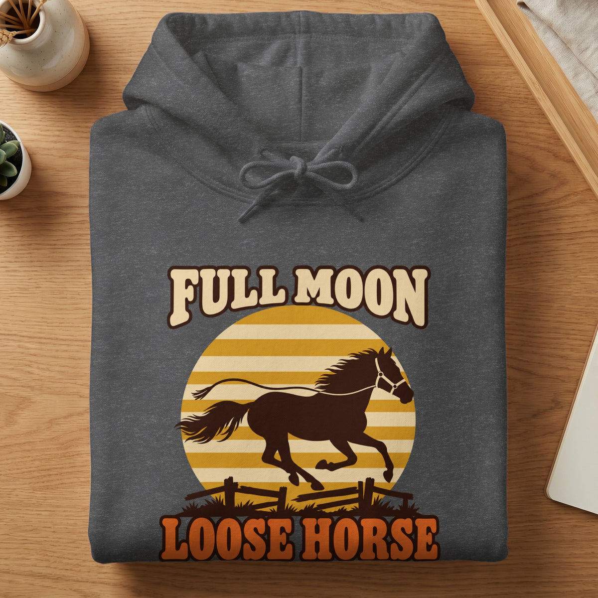 Dark grey hoodie with a graphic of a horse running in front of a striped circle.