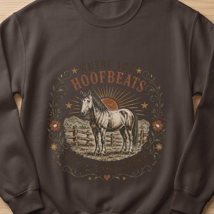 Brown sweatshirt with a horse graphic and text "WHERE THE HOOFBEATS FEEL LIKE HOME".