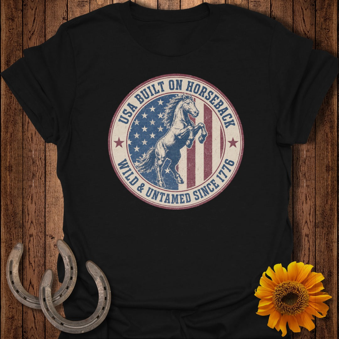 Black t-shirt with distressed circular graphic of rearing horse and American flag.