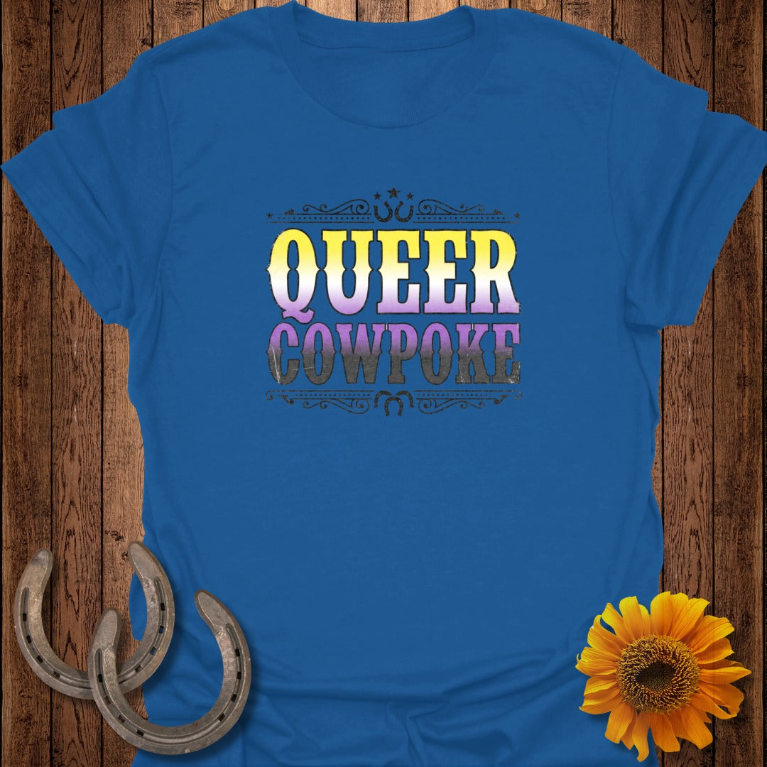 Blue t-shirt with "QUEER COWPOKE" text and decorative elements.