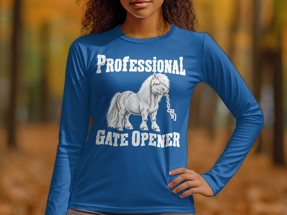 A woman wears a royal blue long-sleeve shirt with a graphic of a white pony biting a chain. Text reads Professional Gate Opener.