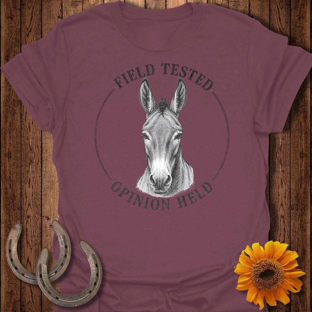 Mule graphic with text "FIELD TESTED OPINION HELD" on maroon t-shirt.