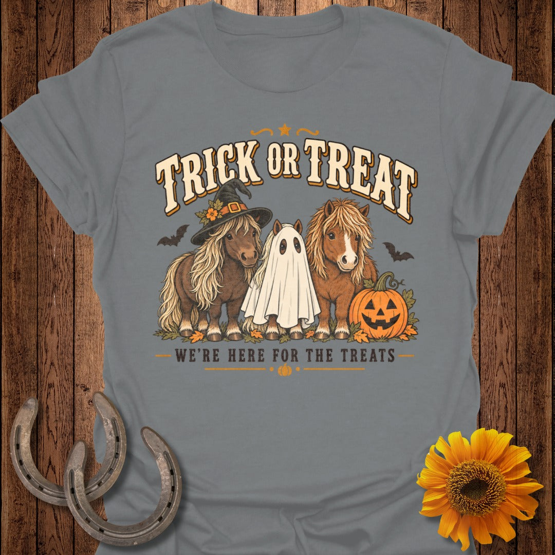 Ponies in Halloween costumes and a ghost with text "Trick or Treat" and "We're here for the treats."