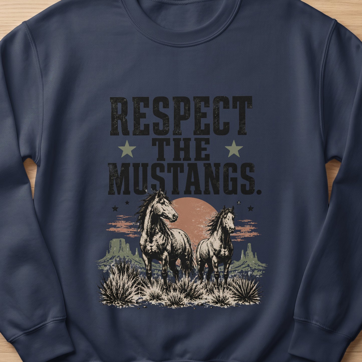 Navy sweatshirt with distressed text "Respect the Mustangs" and two horses in a desert landscape.